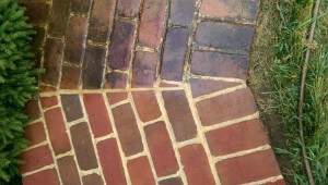 Power Washing Brick walkway during