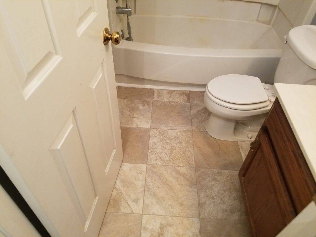 Remodeled bathroom with new vanity, tile and tub surround in Winchester, VA by A+ Handyman