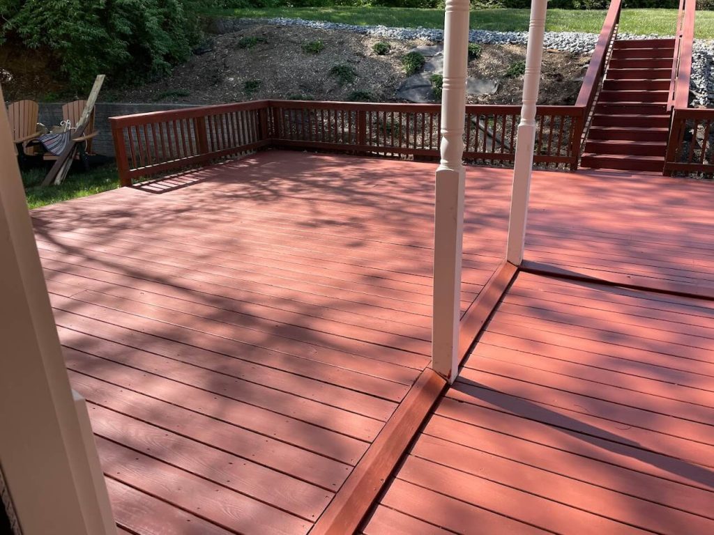 Rebuilt and freshly stained backyard deck in Winchester, VA by A+ Handyman